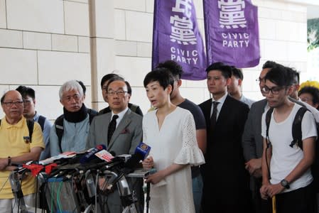 Pro-democracy legislator Tanya Chan speaks to the media about her health condition before entering the court in Hong Kong