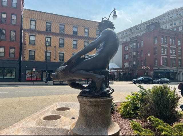 The Turtle Boy statue, at the edge of Worcester Common.