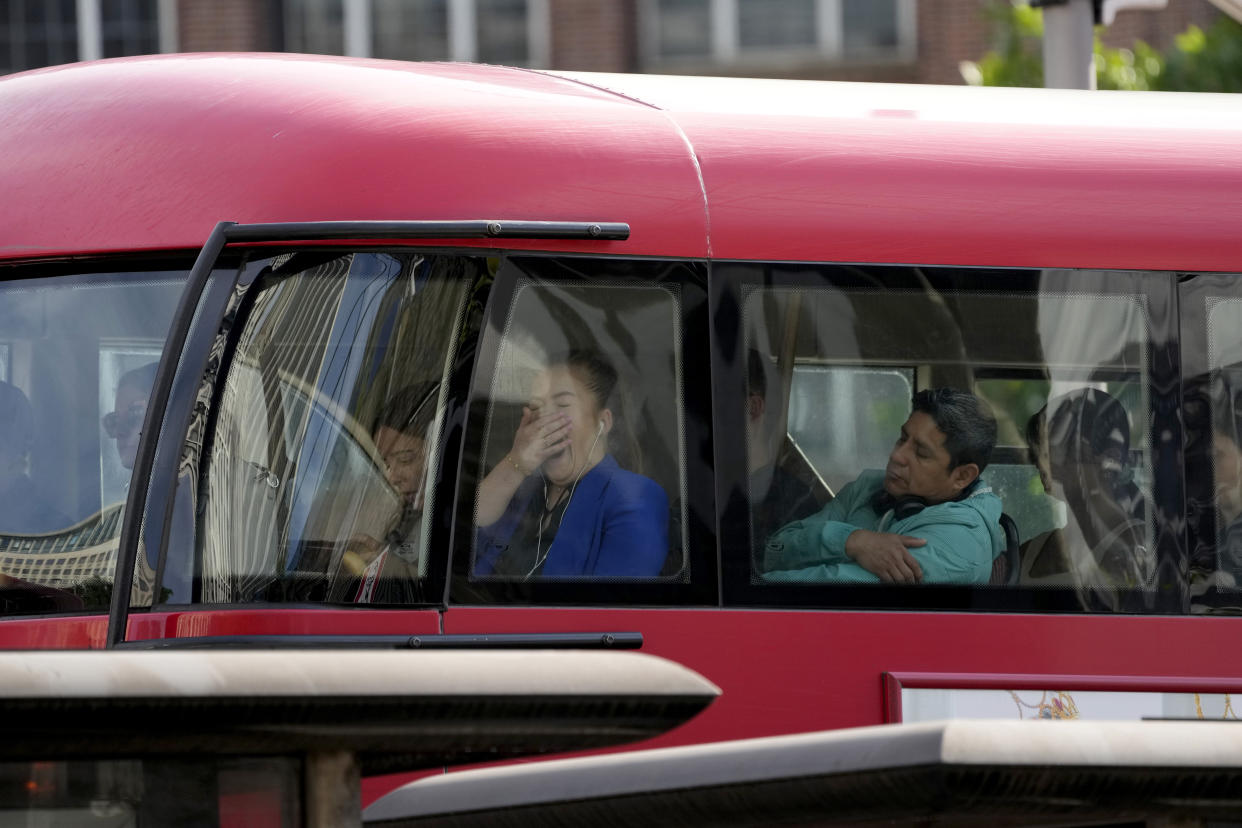 People travel on the top deck of a bus in London, Tuesday, June 21, 2022. Tens of thousands of railway workers walked off the job in Britain on Tuesday, bringing the train network to a crawl in the country’s biggest transit strike for three decades. (AP Photo/Matt Dunham)