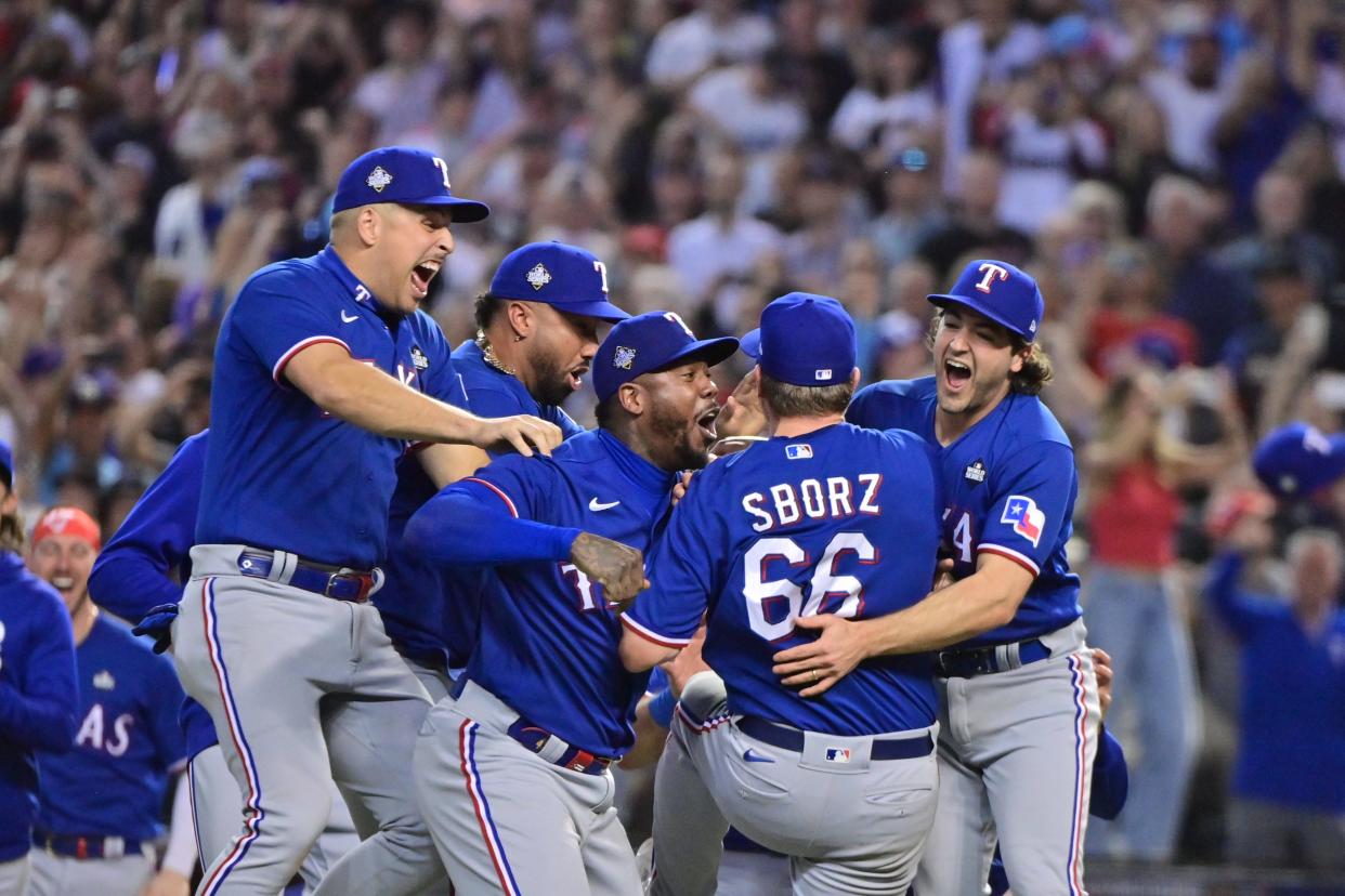 The Rangers celebrate after defeating the Diamondbacks to win the 2023 World Series in Game 5 at Chase Field in Phoenix on Nov. 1, 2023.