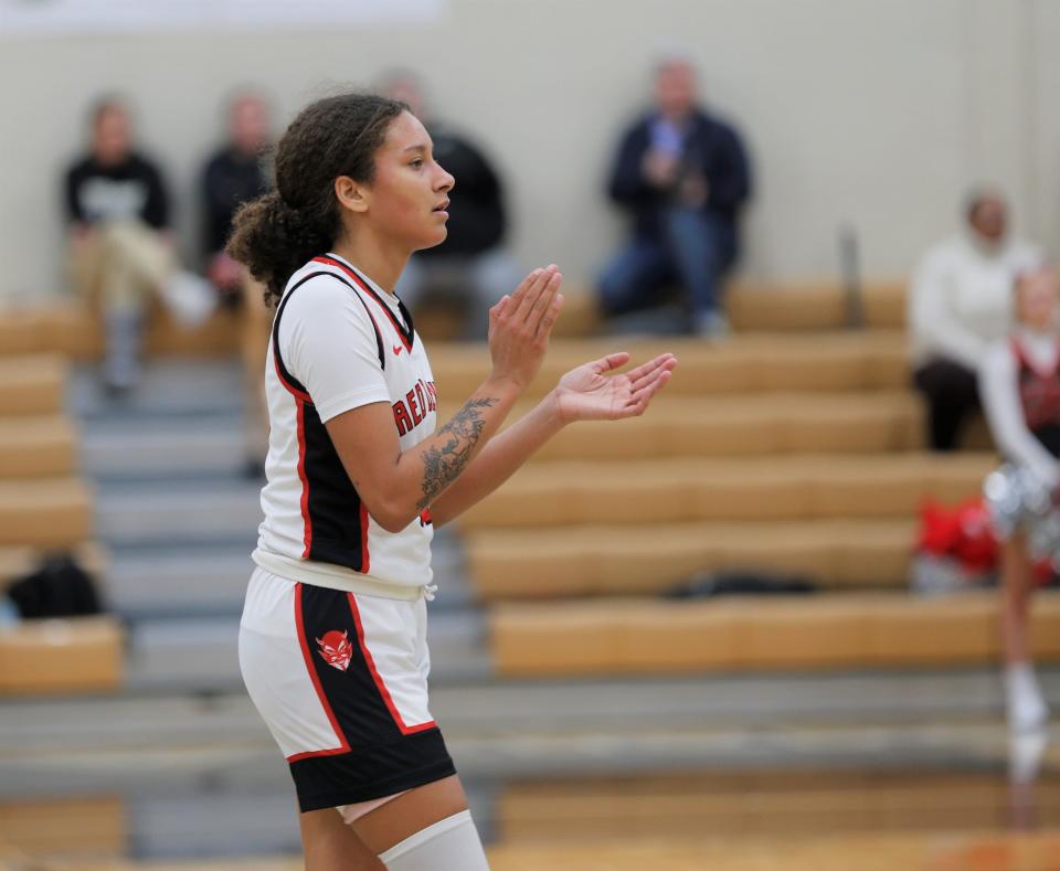 Richmond sophomore Cami Turpin claps for a teammate during a sectional game against New Palestine Feb. 1, 2023.