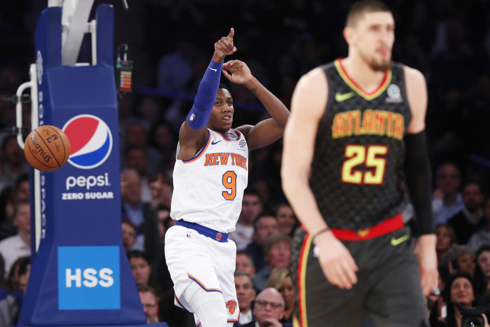 New York Knicks forward RJ Barrett (9) reacts as Atlanta Hawks center Alex Len (25) walks away after Barrett dunked the ball during the first half of an NBA basketball game in New York, Tuesday, Dec. 17, 2019. Barrett had 27 points as the Knicks defeated the Hawks 143-120. (AP Photo/Kathy Willens)