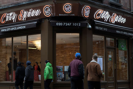 Pedestrians pass the City Spice curry house restaurant on Brick Lane in London, Britain January 7, 2019. Picture taken January 7, 2019. REUTERS/Simon Dawson