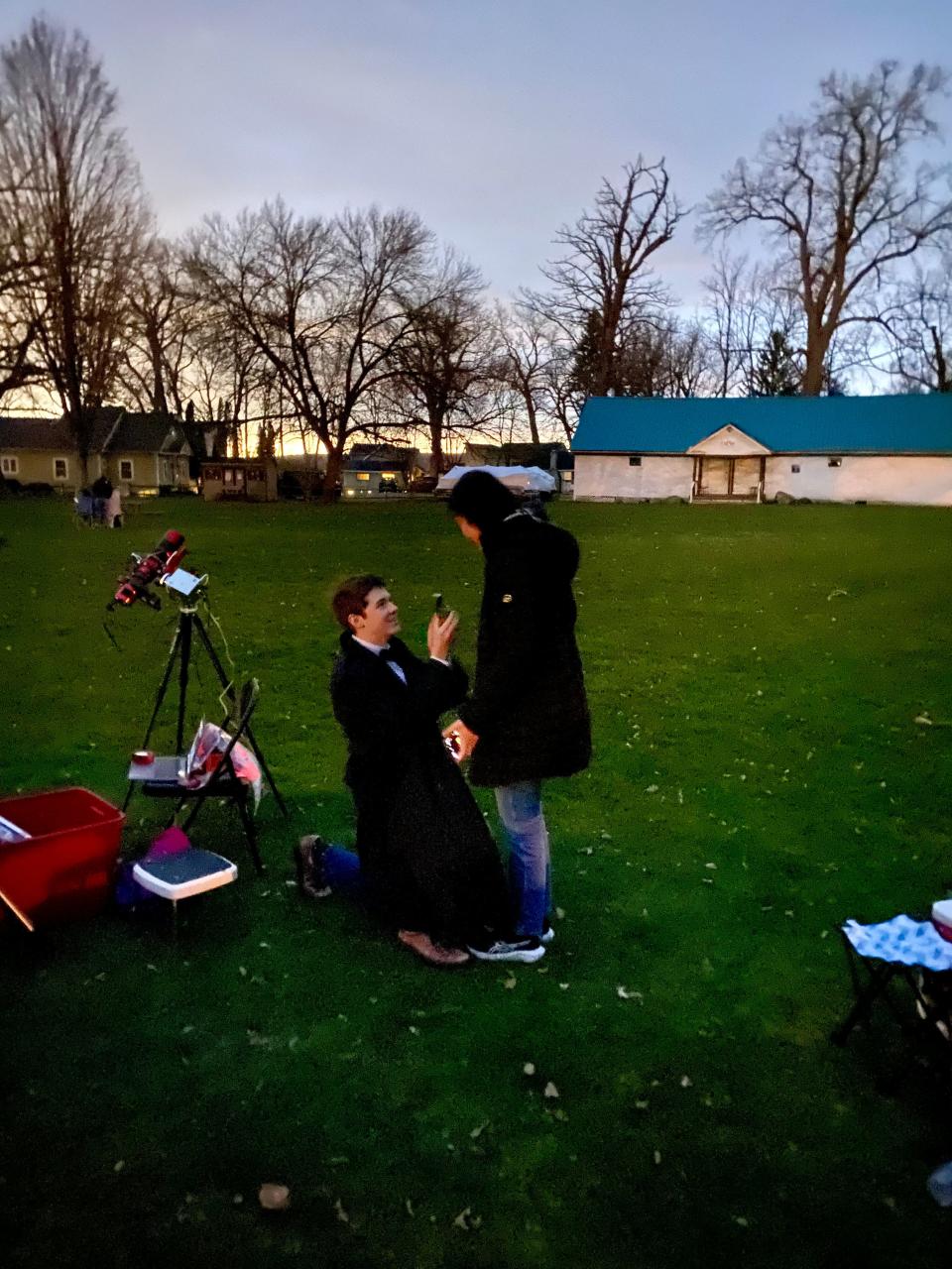 Josef Zimmerman proposes to Amy Wang in Geneseo during the April eclipse.