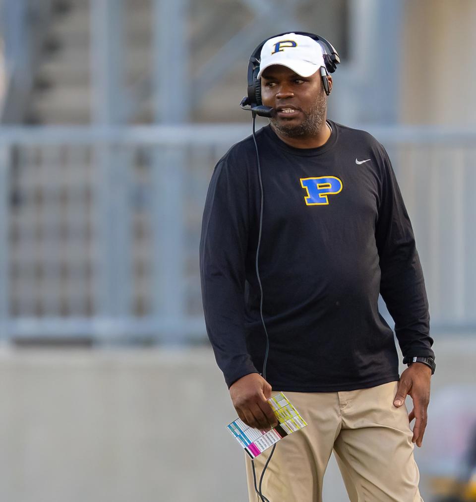 Pflugerville Panthers head coach Charles Taylor watches his team against the Stony Point Tigers during a non-district game last season.