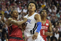 Houston Rockets' Jabari Smith Jr., left, and Orlando Magic's Paolo Banchero look for a rebound during the first half an NBA summer league basketball game Thursday, July 7, 2022, in Las Vegas. (AP Photo/John Locher)