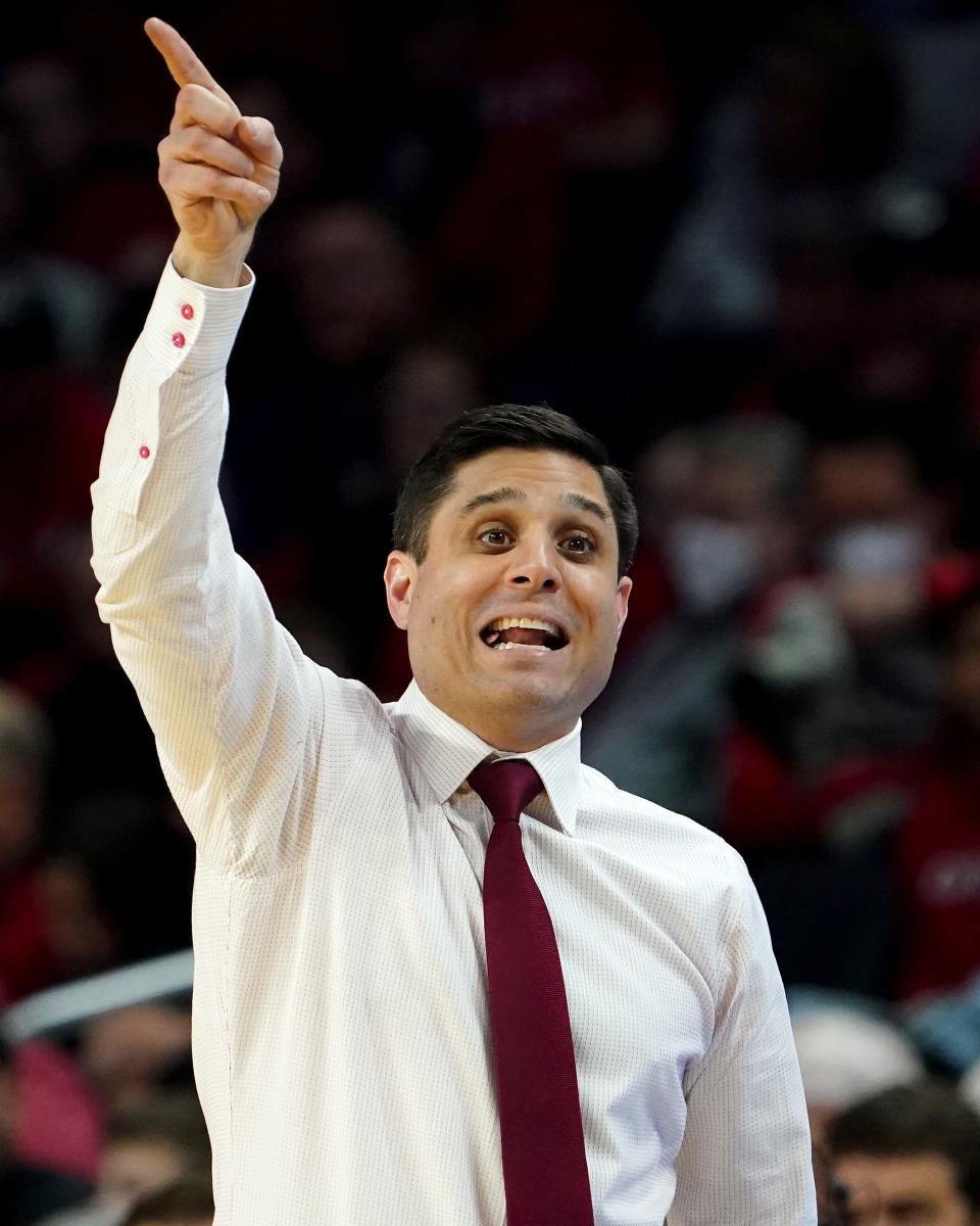 Cincinnati Bearcats head coach Wes Miller instructs the team in the first half of a men's NCAA basketball game against the South Florida Bulls, Saturday, Feb. 26, 2022, at Fifth Third Arena in Cincinnati.