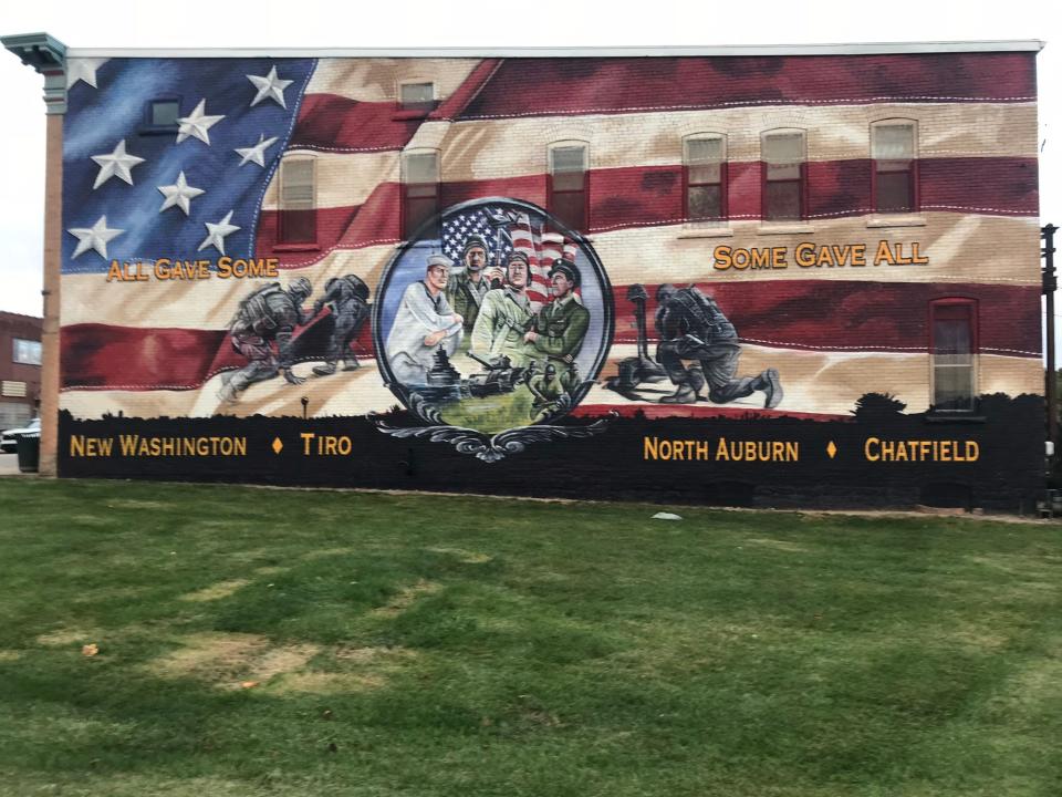 The first phase of the New Washington Veterans Memorial Park project was completed in October 2022 with a mural painted on the nearby library wall by muralist Dean Davis. (PROVIDED BY DAVE RIEDEL)