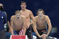 United States relay team react during the men's 4 x200-meter freestyle relay final at the 2020 Summer Olympics, Wednesday, July 28, 2021, in Tokyo, Japan. (AP Photo/Matthias Schrader)