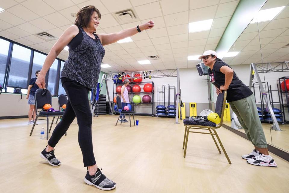 Mitzi Gault, left, participate in a coordination exercise with her instructor Silvana Underwood as part of her Nutrition Exercise and Attitude for Tomorrow (NEAT) exercise program at the Texas Health Southwest Fitness Center in Fort Worth on Tuesday, August 1, 2023.