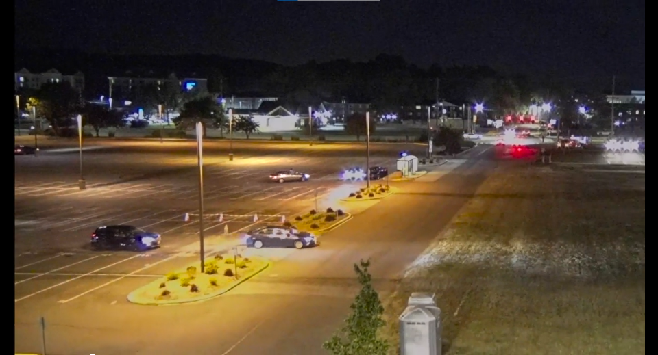 A still image from UD's surveillance footage on top of a building overlooking the parking lot. Sanogo's car is parked and not moving in the spot closest to the median, with no headlights turned on.