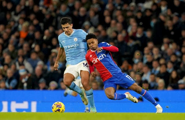 Manchester City's Rodri battles for the ball with Crystal Palace's Matheus Franca