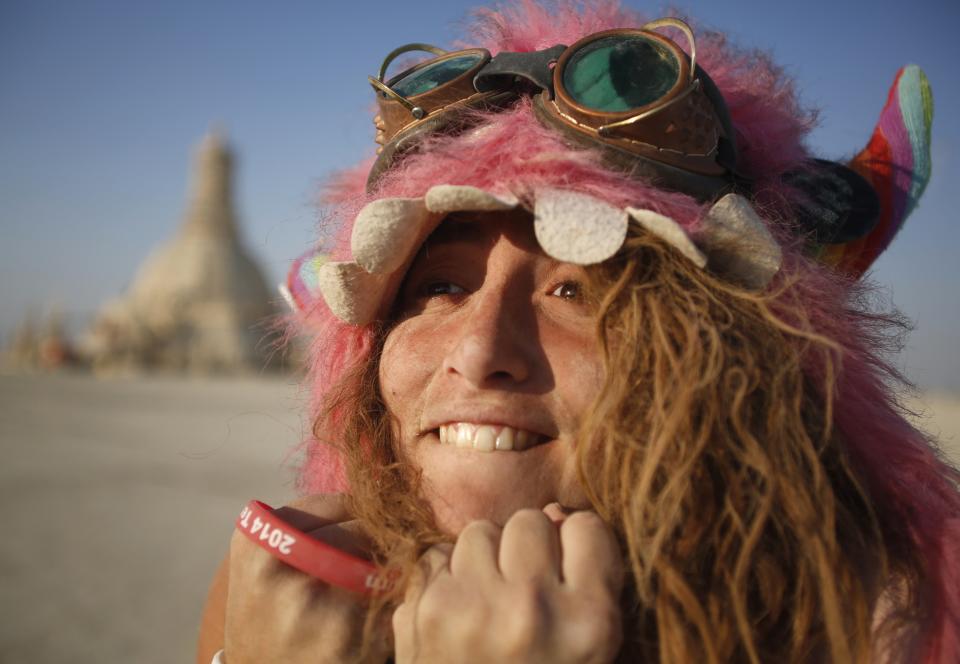 She should have brought her resume. Participant Sandy Candy smiles before the Temple of Grace burns on the last day of the Burning Man 2014. REUTERS/Jim Urquhart (UNITED STATES - Tags: SOCIETY) FOR USE WITH BURNING MAN RELATED REPORTING ONLY. FOR EDITORIAL USE ONLY. NOT FOR SALE FOR MARKETING OR ADVERTISING CAMPAIGNS. NO THIRD PARTY SALES. NOT FOR USE BY REUTERS THIRD PARTY DISTRIBUTORS