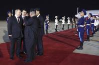 Russian President Vladimir Putin, left, listens to North Korea's leader Kim Jong Un upon his arrival at the Pyongyang Sunan International Airport outside Pyongyang, North Korea, on Tuesday, June 18, 2024. (Gavriil Grigorov, Sputnik, Kremlin Pool Photo via AP)