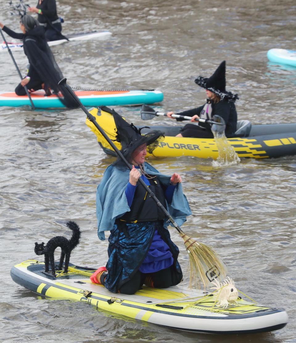 Witches take to the water of the Hudson River during the 4th annual SUP Witches Festival in Sleepy Hollow Oct. 22, 2023. Hundreds of spectators lined the walkway around HoranÕs Landing to view the witches on paddle boards and Kayaks, some with their little dogs, enjoying the day. The event, which grows larger every year, is sponsored by Rivertown SUP & Yoga.
