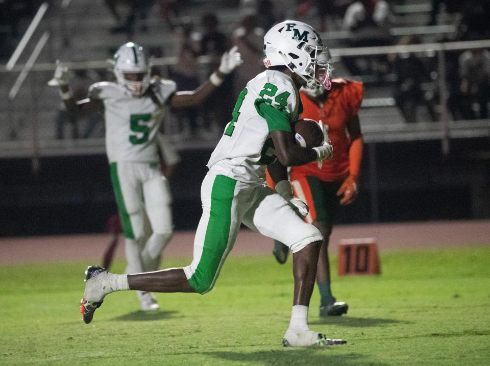 Madrid Tucker of Fort Myers runs in a touchdown on Friday, Sept. 15, 2023, at Dunbar High School. Dunbar won 40-39 in double overtime.