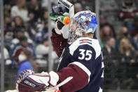 Colorado Avalanche goaltender Darcy Kuemper cools off in the second period of an NHL hockey game against the Minnesota Wild, Monday, Jan. 17, 2022, in Denver. (AP Photo/David Zalubowski)