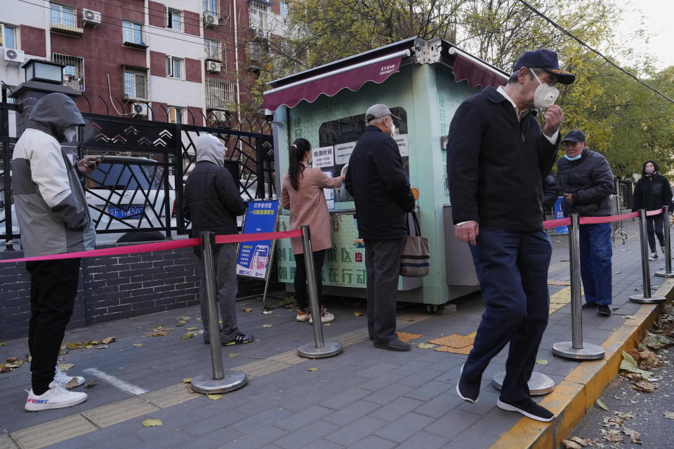 Residents line up for COVID-19 tests in Beijing, Saturday, Nov. 26, 2022. (AP Photo/Ng Han Guan)