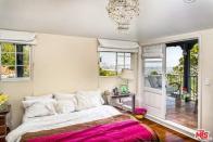 <p>The master suite has a loggia balcony with spectacular views of the city. (Realtor.com) </p>