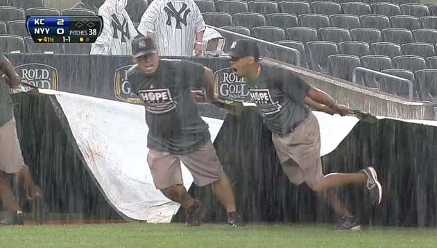 LOOK: KC grounds crew member gets rolled by tarp at ALDS