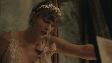 Taylor Swift in a music video on her "Evermore" album
