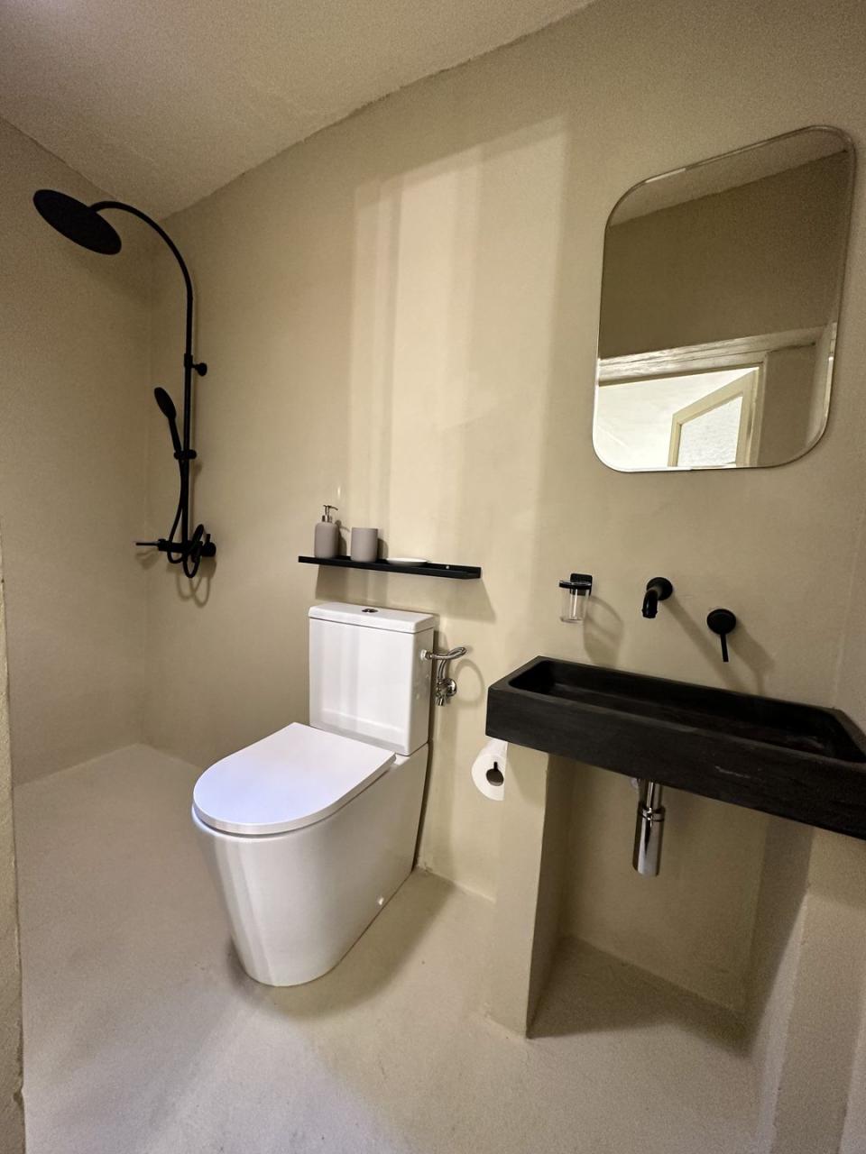 a bathroom with a toilet and sink