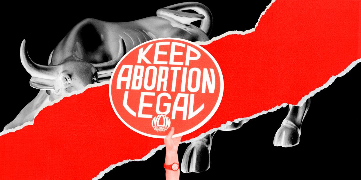 Keep abortion legal sign in front of Wall street bull