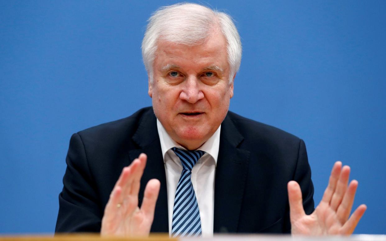 German interior minister Horst Seehofer has repeatedly clashed with Angela Merkel over migrant policy - REUTERS