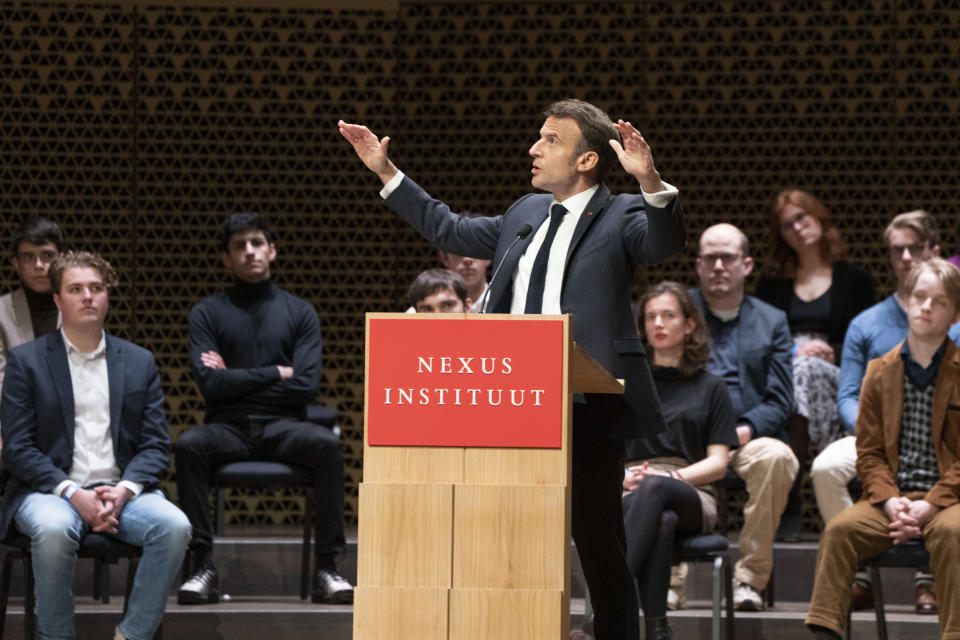 French President Emmanuel Macron explains his vision on the future of Europe during a lecture in a theatre in The Hague, Netherlands, Tuesday, April 11, 2023. (AP Photo/Peter Dejong)