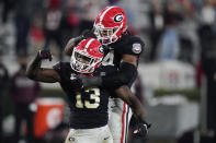 Georgia linebacker Azeez Ojulari (13) celebrates with defensive lineman Travon Walker (44) after a sack during the second half of the team's NCAA college football game against Mississippi State, Saturday, Nov. 21, 2020, in Athens, Ga. (AP Photo/Brynn Anderson)