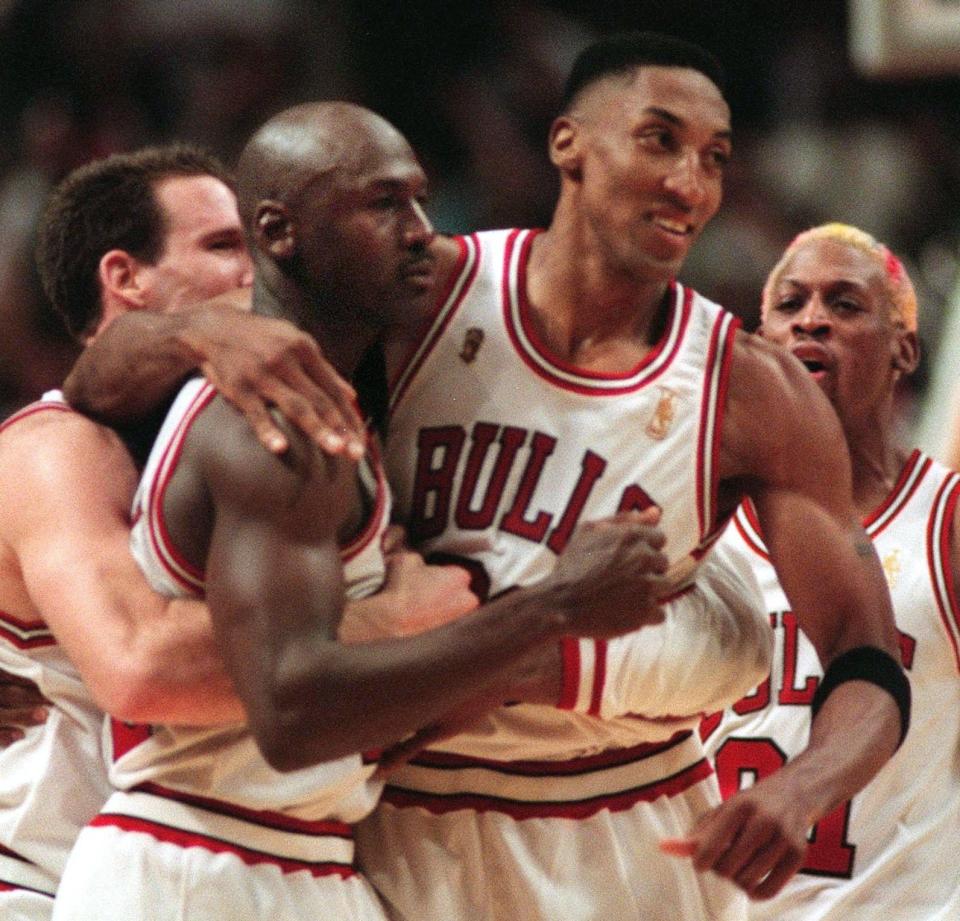 Chicago Bulls' Scottie Pippen, right, puts his arm around teammate Michael Jordan after Jordan made a last second shot to give the Bulls an 84-82 win over the Utah Jazz in Game 1 of the 1997 NBA Finals.