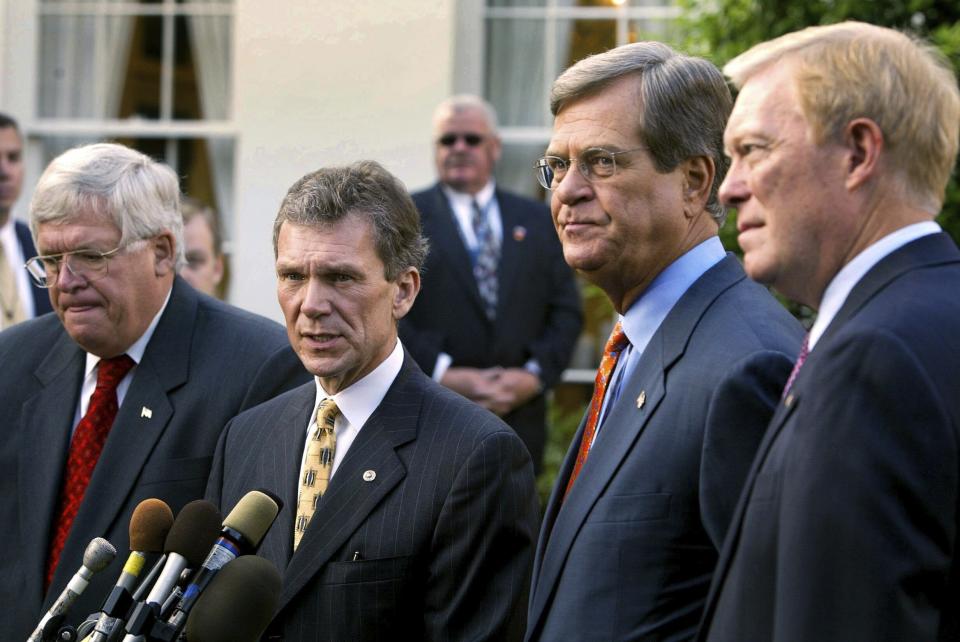 FILE - Senate Majority Leader Tom Daschle, D-S.D., center, talks to reporters with Senate Minority Leader Trent Lott, R-Miss, House Minority Leader Dick Gephardt, right, D-Mo., and Speaker of the House of Representatives Dennis Hastert, left, R-Ill., look on, following a breakfast meeting with President George W. Bush on Iraq in the White House Oval Office, Wednesday, Oct 2, 2002. (AP Photo/Doug Mills, File)