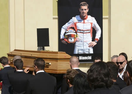 Pallbearers carry the coffin of late Marussia Formula One driver Jules Bianchi followed by family members and his father Philippe Bianchi before the funeral ceremony at the Sainte Reparate Cathedral in Nice