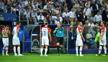 Soccer Football - World Cup - Final - France v Croatia - Luzhniki Stadium, Moscow, Russia - July 15, 2018 Referee Nestor Pitana calls for a penalty after a VAR review REUTERS/Dylan Martinez