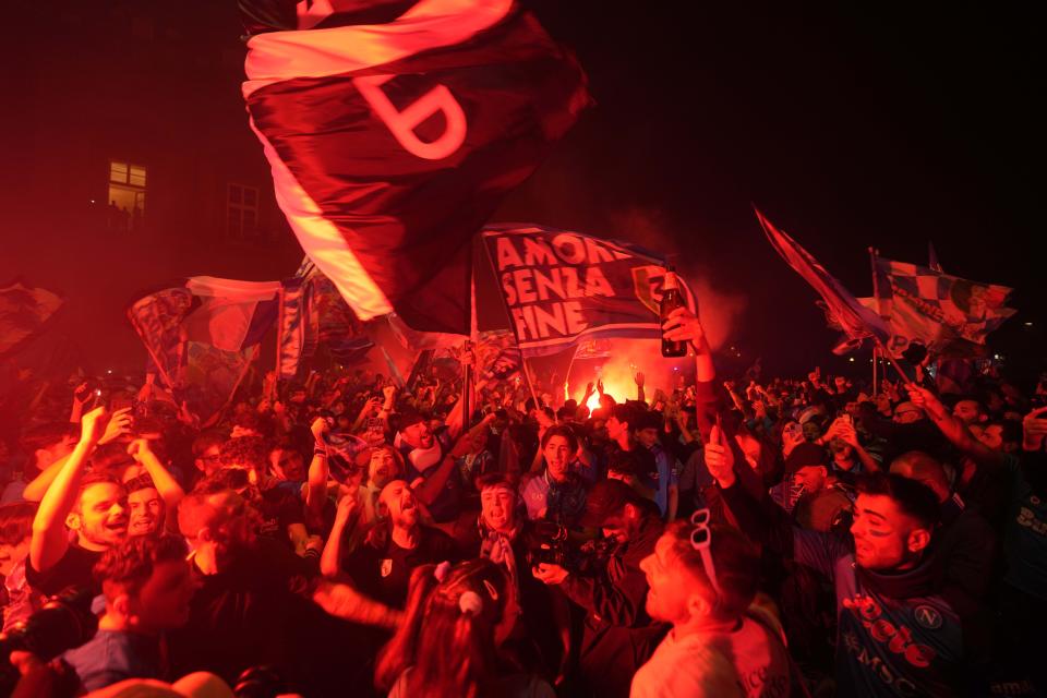 Napoli fans celebrates after winning the Italian league soccer title, in Naples, Italy, Thursday, May 4, 2023. Napoli won its first Italian soccer league title since the days when Diego Maradona played for the club, sealing the trophy with a 1-1 draw at Udinese on Thursday. (AP Photo/Andrew Medichini)