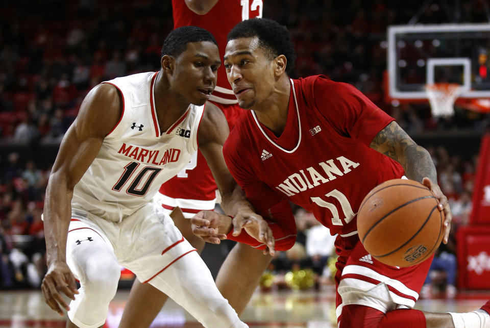 Indiana guard Devonte Green, right, drives around Maryland guard Serrel Smith Jr. in the first half of an NCAA college basketball game, Friday, Jan. 11, 2019, in College Park, Md. (AP Photo/Patrick Semansky)