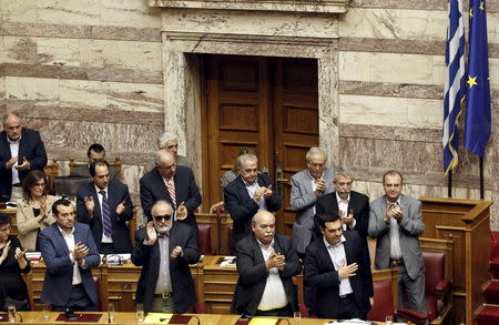 Greek Prime Minister Alexis Tsipras (bottom R) acknowledges applause during a parliamentary session in Athens, Greece June 28, 2015. REUTERS/Alkis Konstantinidis