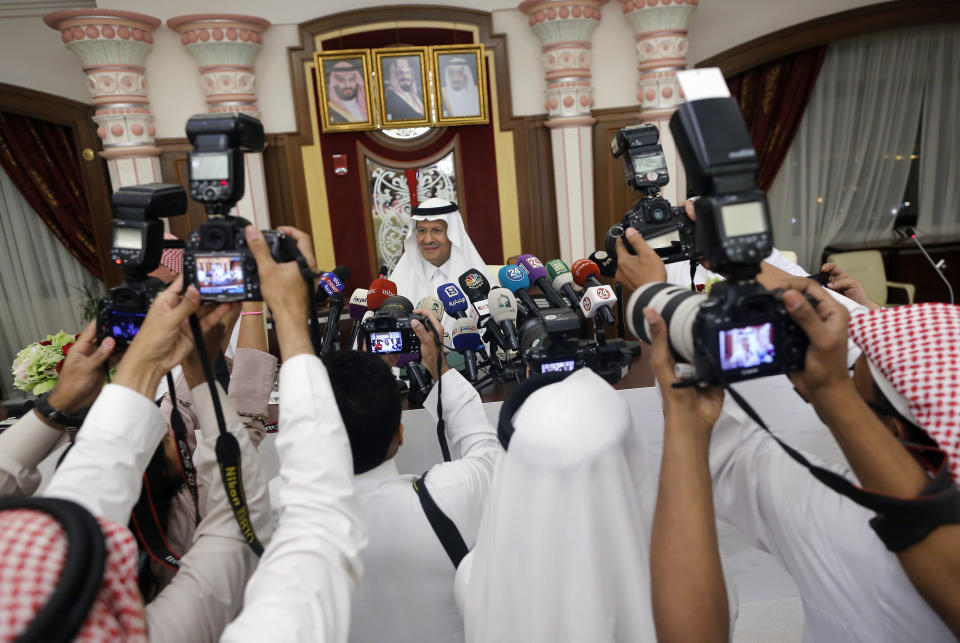 Saudi Energy Minister Prince Abdulaziz bin Salman, is surrounded by photographers as he enters a press conference in Jiddah, Saudi Arabia, Tuesday, Sept. 17, 2019. (AP Photo/Amr Nabil)
