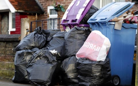 Refuse waiting to be collected in Liverpool, Merseyside - Credit: PA