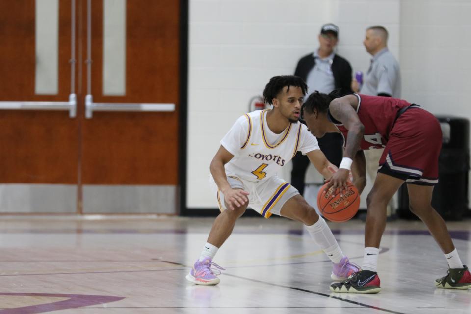 Kansas Wesleyan's Marcel Dean (4) guards Sterling's Taron Batie (24) during Thursday's game at Mabee Arena.