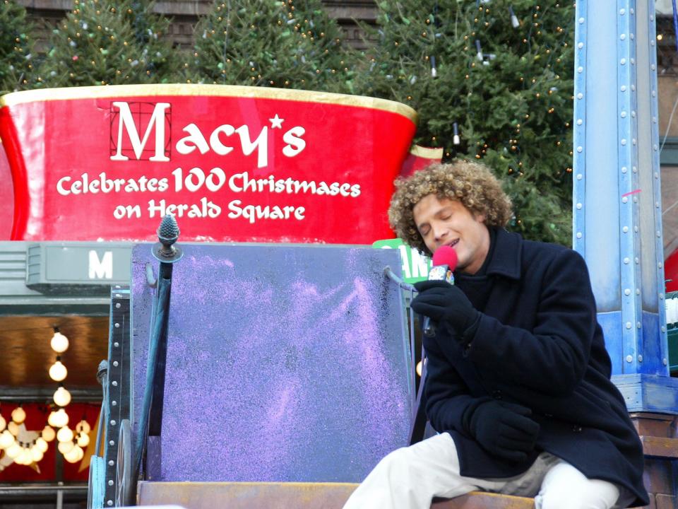 Justin Guarini of American Idol sings at the Macy's thanksgiving day parade in 2002