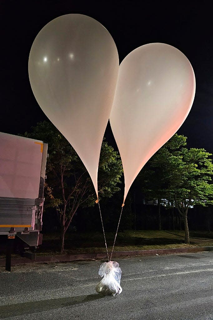 FILE - This photo provided by the South Korean Ministry of Defense shows balloons carrying waste, believed to be sent by North Korea, in South Chungcheong Province, South Korea, on Wednesday, May 29, 2024. North Korea launched more waste-bearing balloons headed south after According to the South Korean military, a similar campaign was carried out earlier this week, in what Pyongyang calls retaliation for activists distributing anti-North Korean leaflets across the border.  (South Korean Ministry of Defense via AP, file)