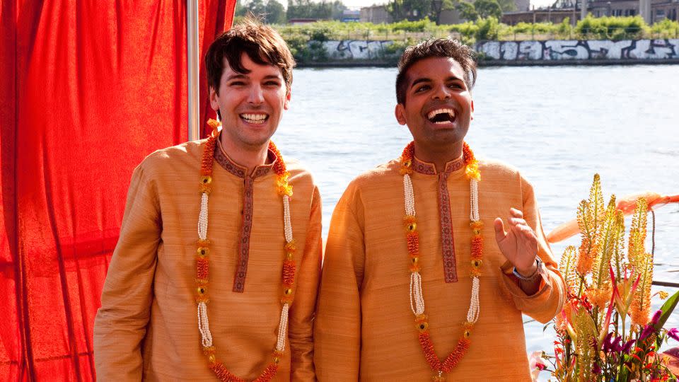 Manuel and Suki arrived at their second wedding celebration by boat. - TinaWeissFotografie