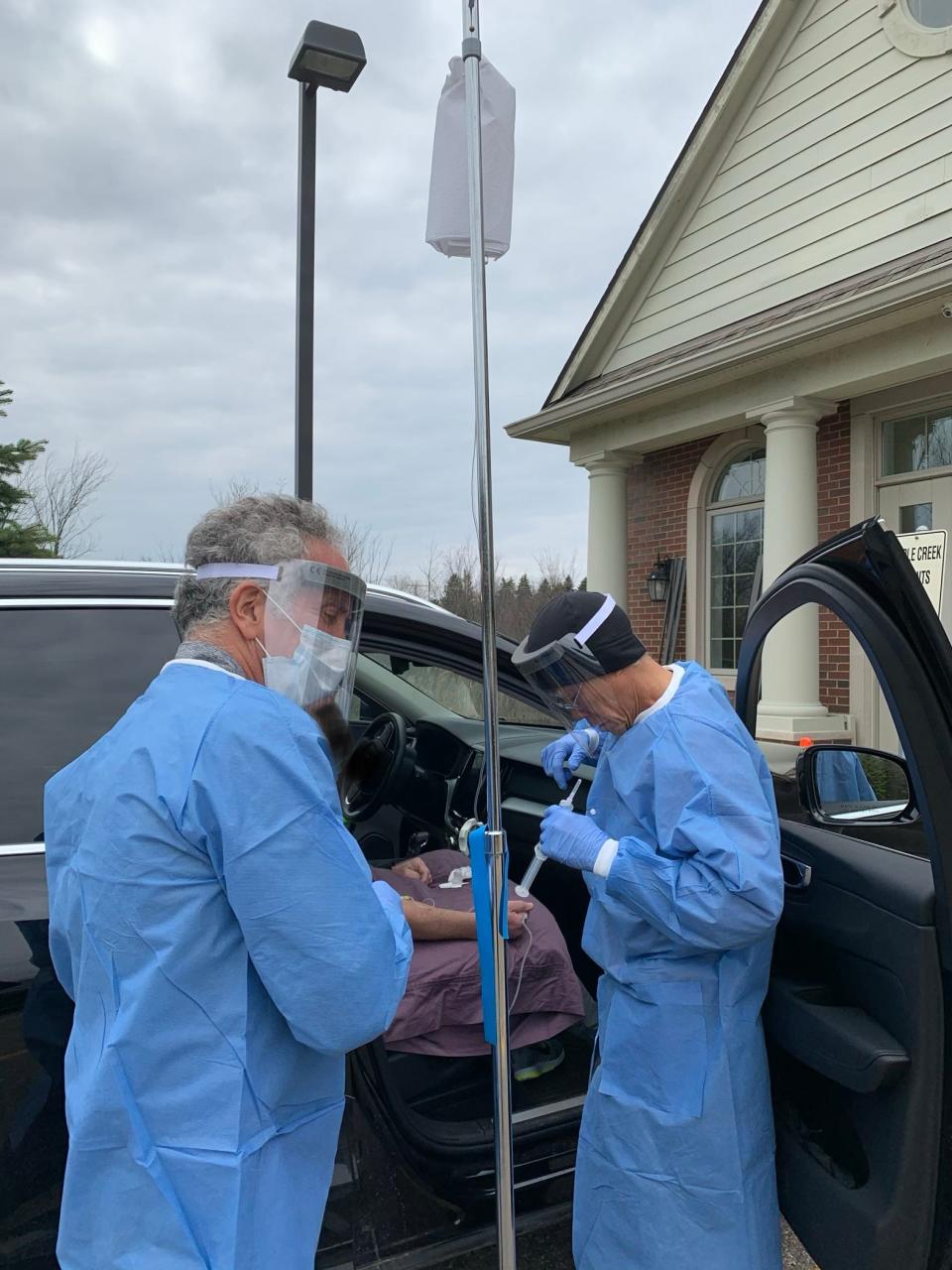 Dr. Brownstein administering viral treatment to patients in April.