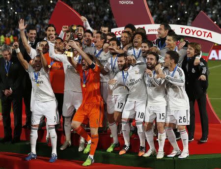 Real Madrid celebrates winning the Club World Cup final soccer match against San Lorenzo at Marrakesh stadium December 20, 2014. REUTERS/Youssef Boudlal