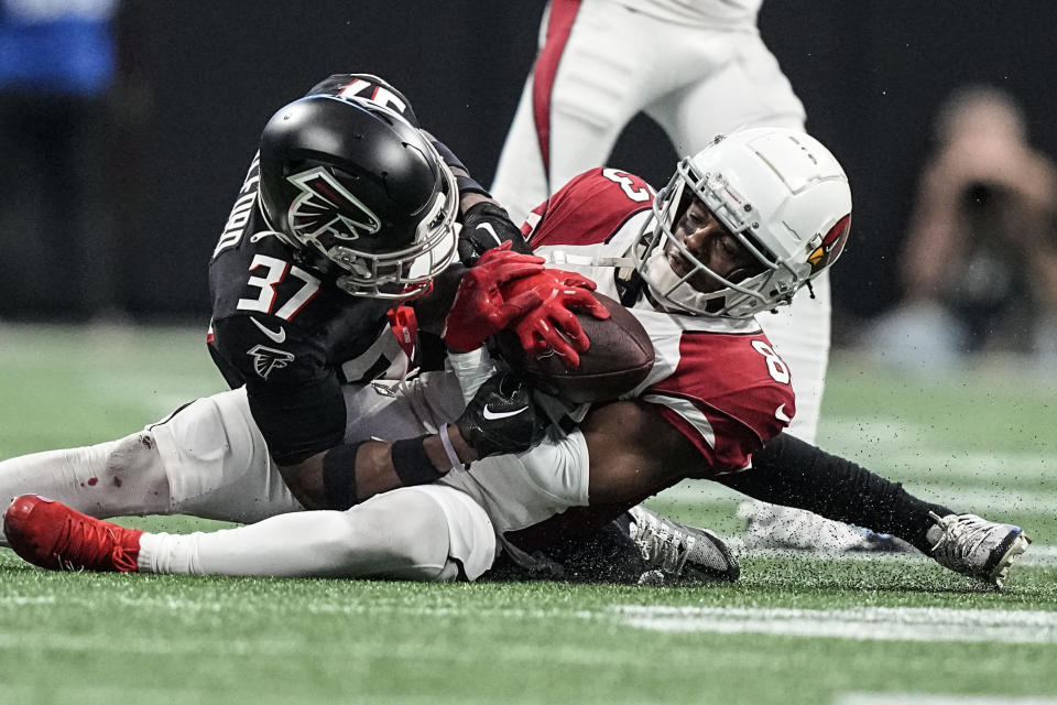 Arizona Cardinals wide receiver Greg Dortch (83) makes the catch against Atlanta Falcons cornerback Dee Alford (37) during the second half of an NFL football game, Sunday, Jan. 1, 2023, in Atlanta. (AP Photo/Brynn Anderson)