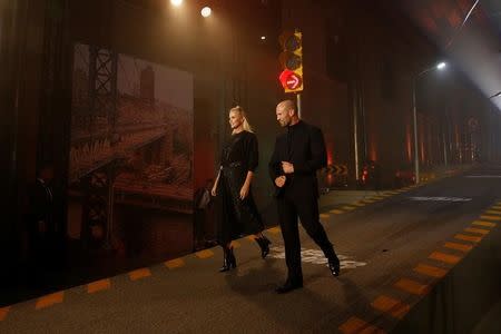 Actors Charlize Theron (L) and Jason Statham attend a media event for the new film "The Fate of the Furious" in Beijing, China March 23, 2017. REUTERS/Aly Song/Files