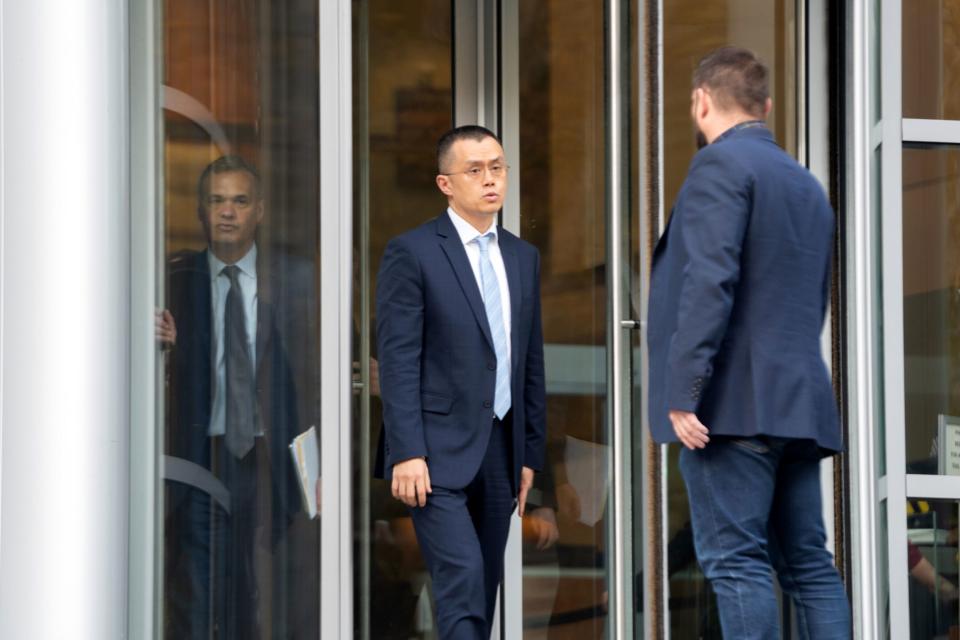 Changpeng Zhao, former chief executive officer of Binance Holdings Ltd., center, exits federal court in Seattle in November.