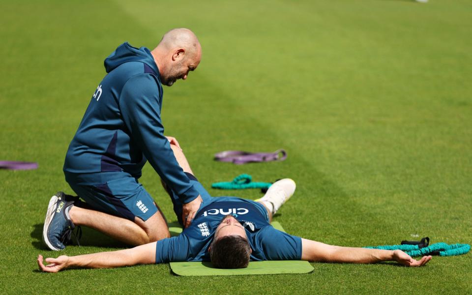 England's Chris Woakes receives treatment during training - ECB prioritising the Hundred has undermined the Ashes