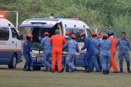 A body believed to be 15-year-old Irish girl Nora Anne Quoirin who went missing is brought into a ambulance in Seremban